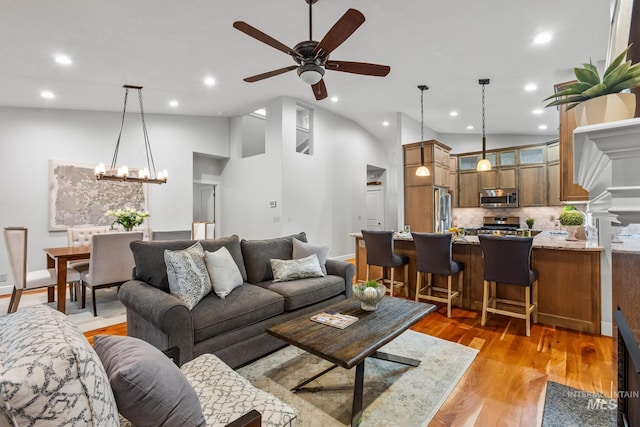 2411 S Marypost, Eagle, ID 83616 - living area with a ceiling fan, recessed lighting, light wood-style floors, vaulted ceiling, and a chandelier