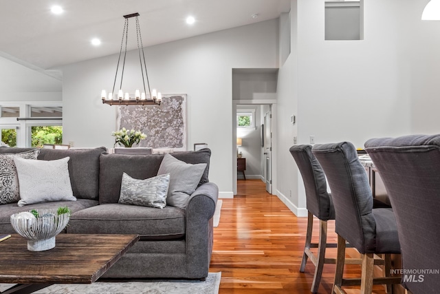 2411 S Marypost, Eagle, ID 83616 - living room with light wood-type flooring, a chandelier, plenty of natural light, recessed lighting, and high vaulted ceiling