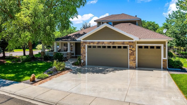 2411 S Marypost, Eagle, ID 83616 - craftsman house with a garage, concrete driveway, covered porch, a front yard, and stone siding
