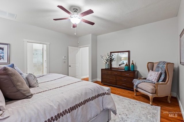 2411 S Marypost, Eagle, ID 83616 - bedroom with wood finished floors, ensuite bath, and a ceiling fan