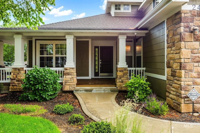 2411 S Marypost, Eagle, ID 83616 - doorway to property with a porch, stone siding, and a shingled roof