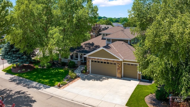 2411 S Marypost, Eagle, ID 83616 - view of front of home with a garage, stone siding, a front lawn, roof with shingles, and concrete driveway