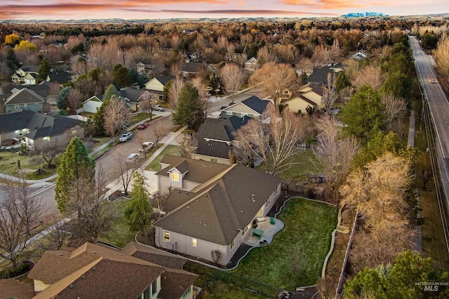 birds eye view of property with a residential view