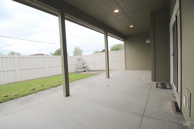 view of patio featuring fence