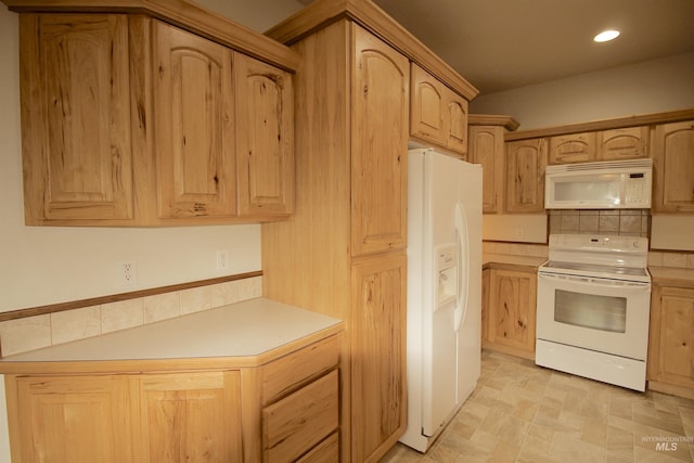 kitchen featuring white appliances, light brown cabinetry, light countertops, recessed lighting, and decorative backsplash