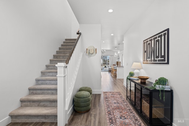 10148 Irongate Dr, Nampa, ID 83687 - stairs with recessed lighting, wood finished floors, and baseboards