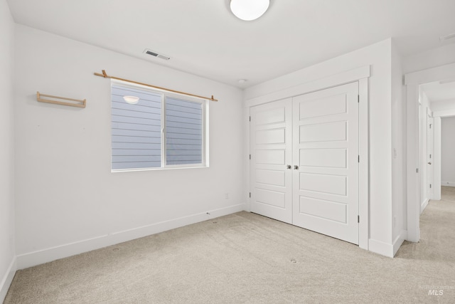 10148 Irongate Dr, Nampa, ID 83687 - unfurnished bedroom featuring carpet, a closet, baseboards, and visible vents
