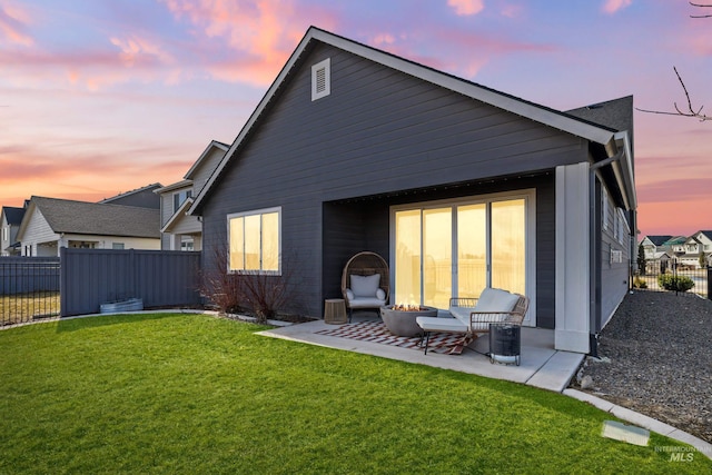 10148 Irongate Dr, Nampa, ID 83687 - back of house featuring a fenced backyard, a fire pit, a yard, and a patio