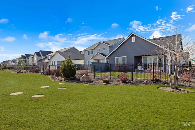 10148 Irongate Dr, Nampa, ID 83687 - exterior space featuring a front lawn, fence, and a residential view