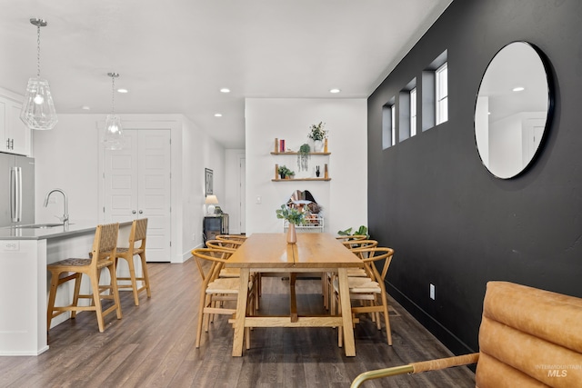 10148 Irongate Dr, Nampa, ID 83687 - dining area with baseboards, wood finished floors, and recessed lighting