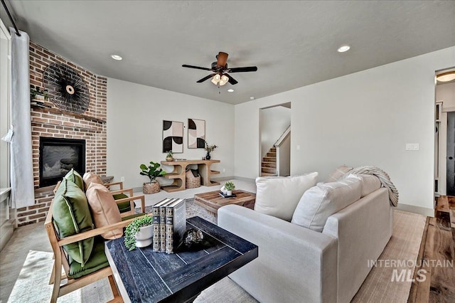 2128 N Woodcreek St, Boise, ID 83704 - living area with a brick fireplace, a ceiling fan, recessed lighting, stairs, and baseboards