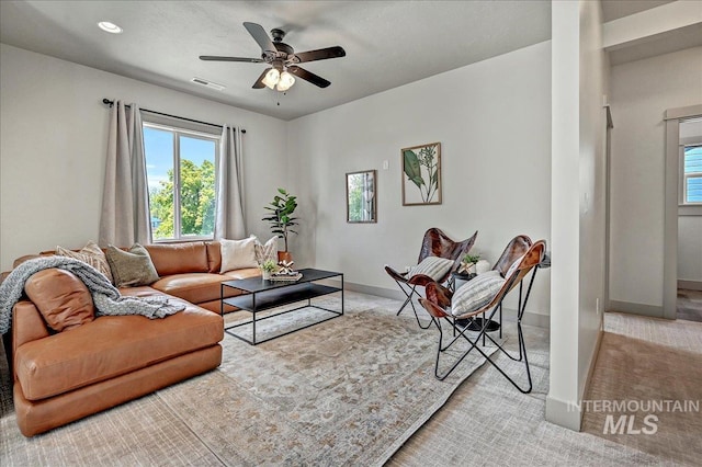 2128 N Woodcreek St, Boise, ID 83704 - carpeted living area featuring baseboards and a ceiling fan