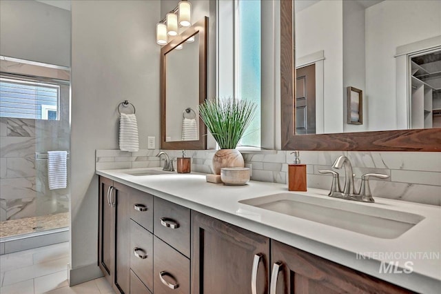 2128 N Woodcreek St, Boise, ID 83704 - bathroom with double vanity, a shower stall, and tasteful backsplash