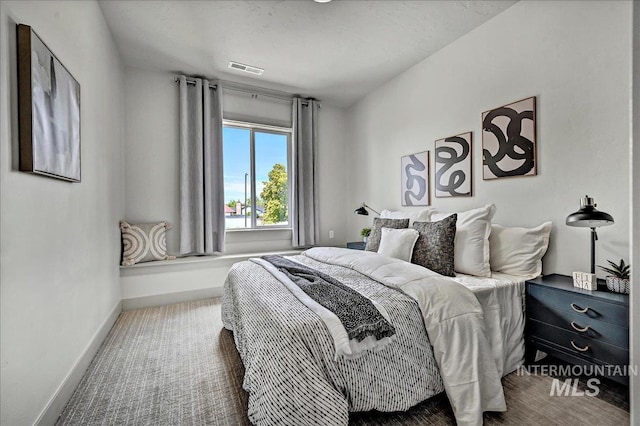 2128 N Woodcreek St, Boise, ID 83704 - bedroom with baseboards and carpet floors