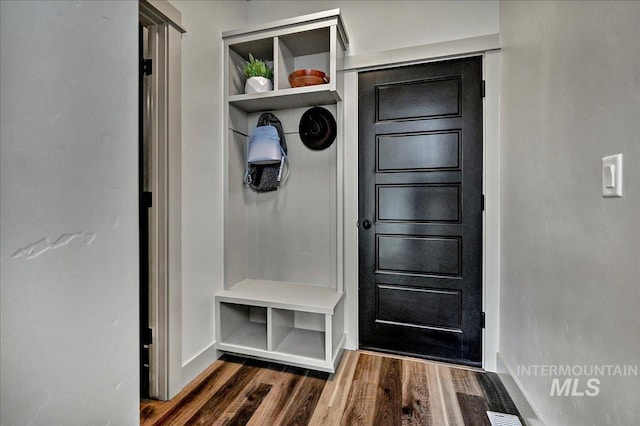 2128 N Woodcreek St, Boise, ID 83704 - mudroom featuring dark wood finished floors and baseboards