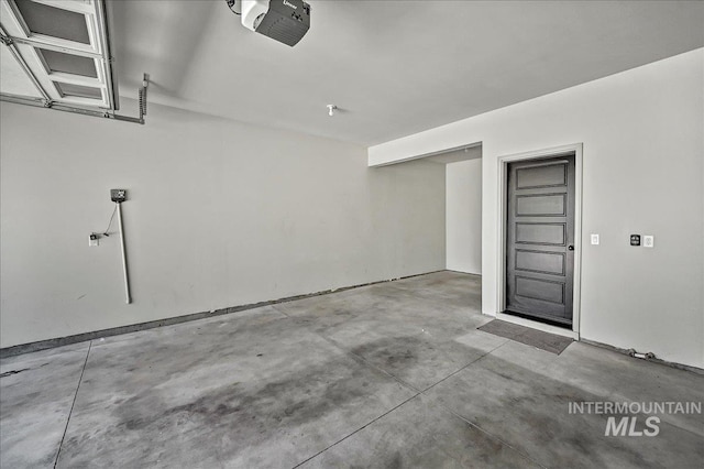 2128 N Woodcreek St, Boise, ID 83704 - garage featuring a garage door opener