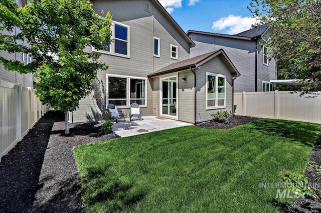 2128 N Woodcreek St, Boise, ID 83704 - back of house with a patio