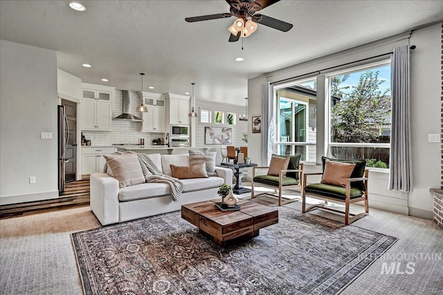 2128 N Woodcreek St, Boise, ID 83704 - living room with ceiling fan, recessed lighting, and light wood-type flooring