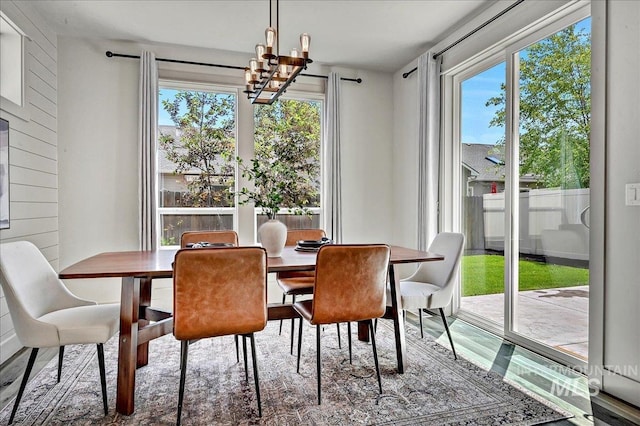 2128 N Woodcreek St, Boise, ID 83704 - dining area with healthy amount of natural light and a chandelier