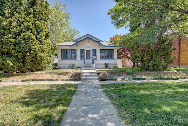 412 6th Ave N, Twin Falls, ID 83301 - bungalow-style home featuring a front yard