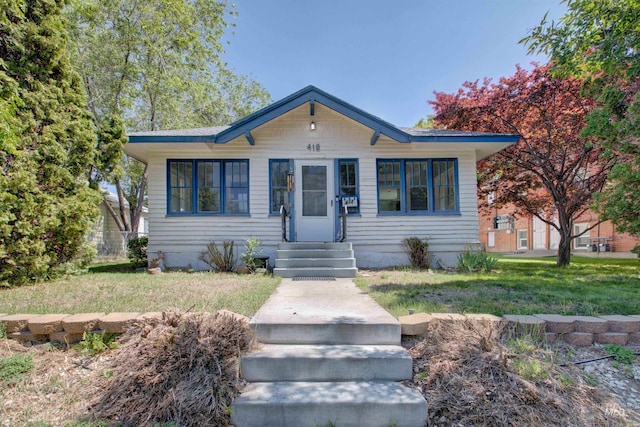 412 6th Ave N, Twin Falls, ID 83301 - bungalow-style house featuring a front lawn
