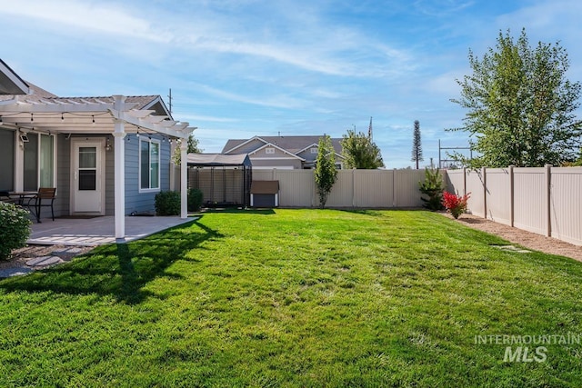 view of yard with a fenced backyard, a patio, and a pergola