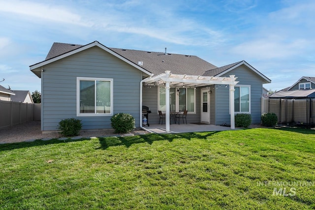 back of property featuring a patio, a shingled roof, fence, a lawn, and a pergola