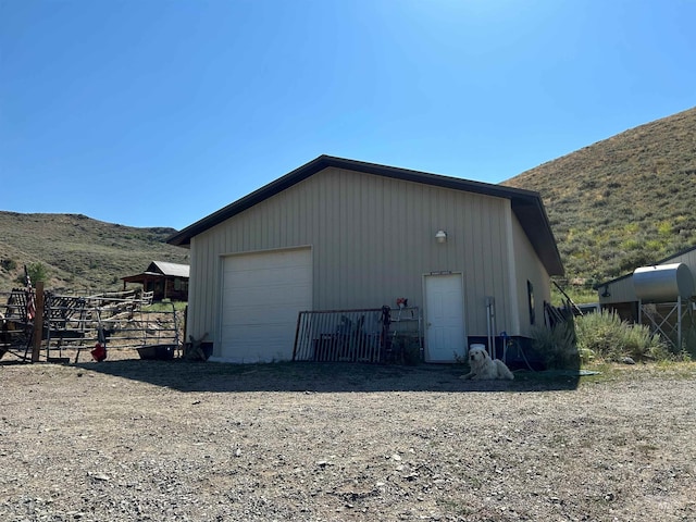 1262 N Soldier Creek Rd, Fairfield, ID 83327 - view of outbuilding with a mountain view, fence, and an outdoor structure