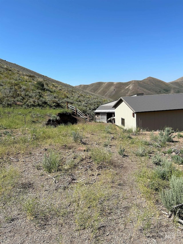 1262 N Soldier Creek Rd, Fairfield, ID 83327 - view of yard with an outdoor structure, a mountain view, and an outbuilding