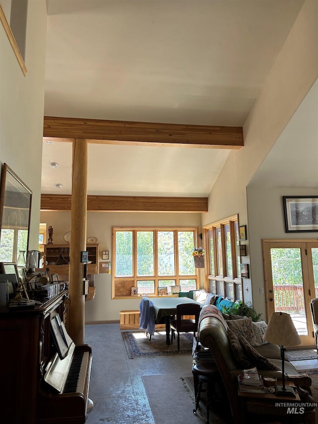 1262 N Soldier Creek Rd, Fairfield, ID 83327 - living room featuring lofted ceiling with beams and baseboards