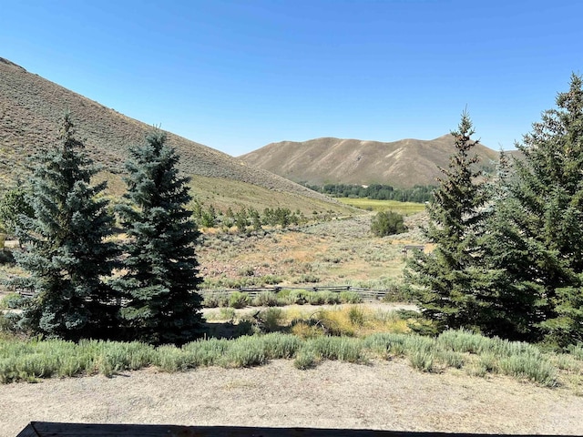 view of mountain feature with a rural view