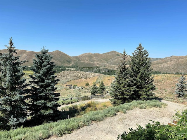 property view of mountains featuring a rural view