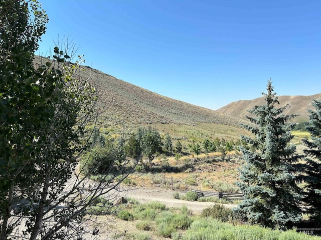 view of mountain feature with a rural view