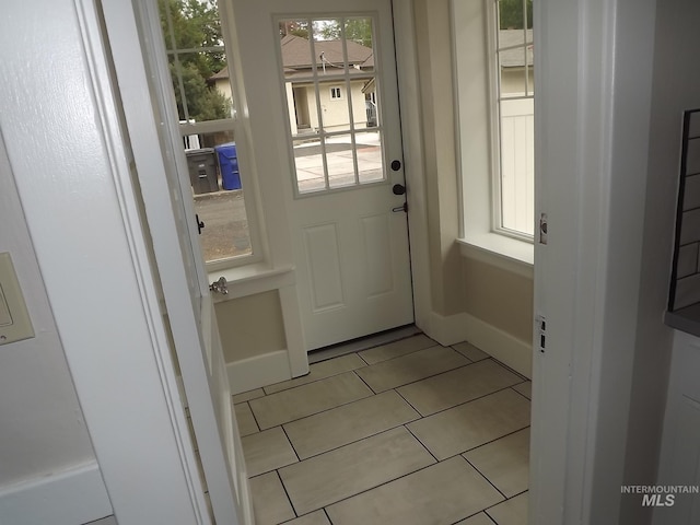 doorway featuring light tile patterned floors