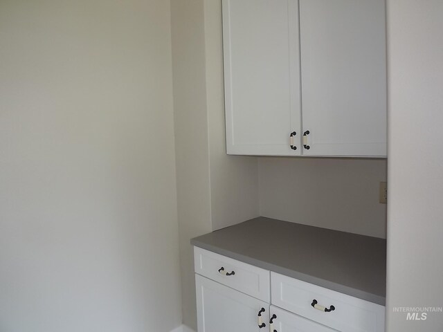 kitchen with white cabinetry