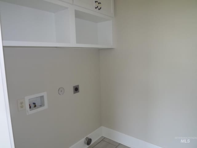 laundry area featuring gas dryer hookup, cabinets, hookup for a washing machine, and electric dryer hookup