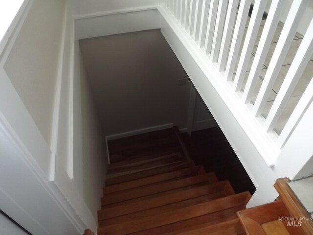 stairs with hardwood / wood-style flooring