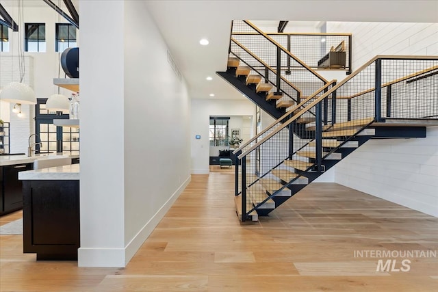 stairway with wood-type flooring