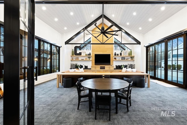 dining area featuring french doors, high vaulted ceiling, wood ceiling, and dark colored carpet