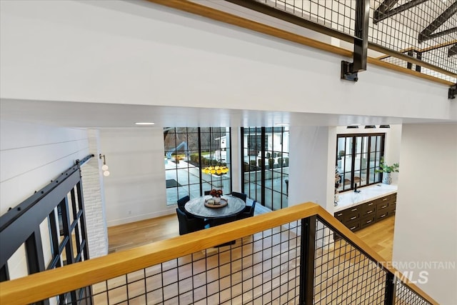 corridor with hardwood / wood-style floors