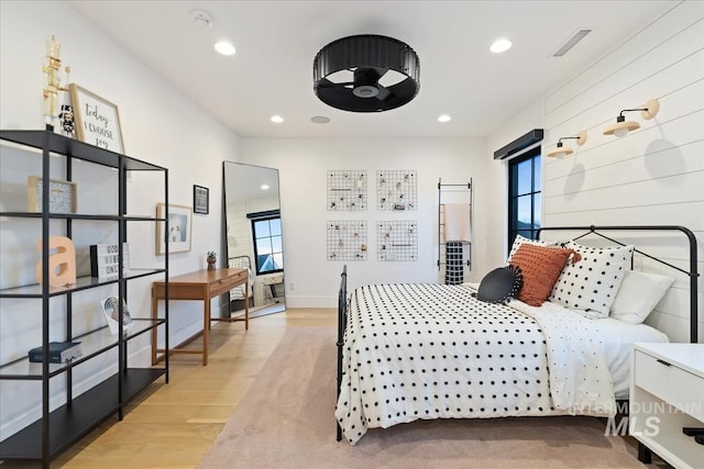 bedroom with light hardwood / wood-style flooring