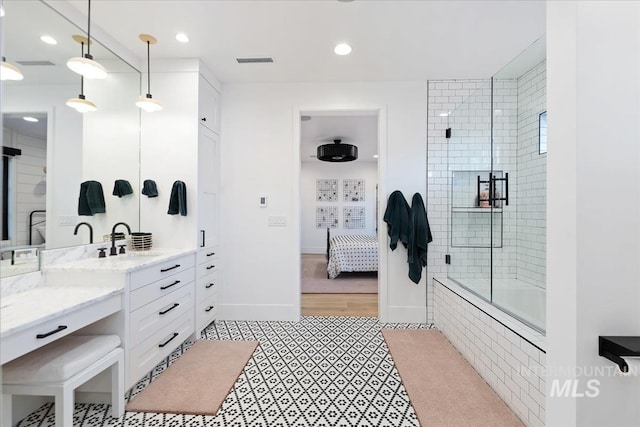 bathroom featuring vanity, hardwood / wood-style floors, and an enclosed shower