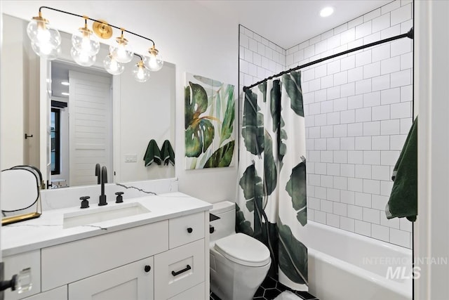 full bathroom featuring vanity, shower / bath combo, and toilet