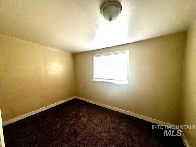 empty room with ceiling fan and light hardwood / wood-style flooring