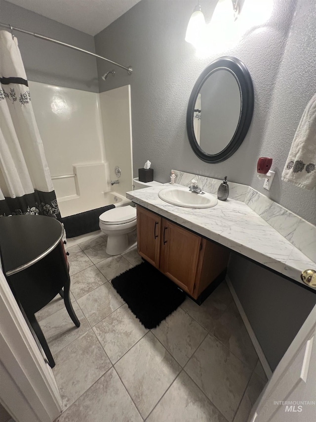 bathroom featuring vanity, shower / bathtub combination with curtain, tile patterned floors, and toilet