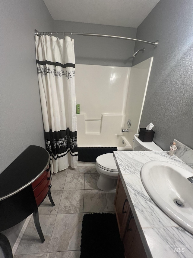 full bathroom featuring vanity, a textured wall, toilet, and shower / bath combination with curtain
