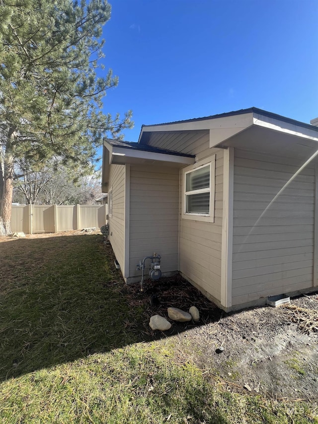 view of side of property with fence