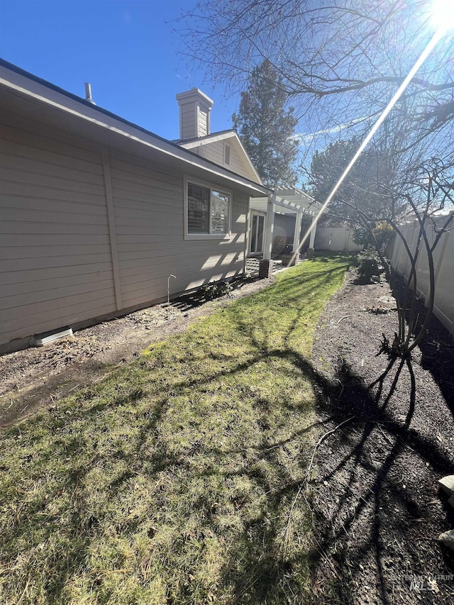 view of yard with a pergola and a fenced backyard