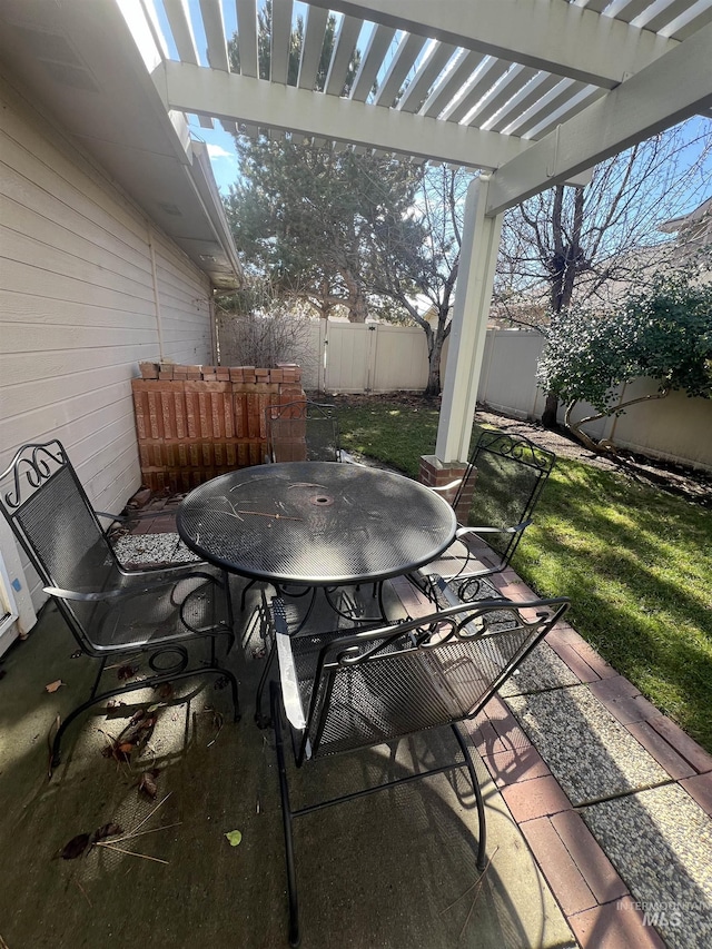 view of patio / terrace with a fenced backyard, outdoor dining space, and a pergola