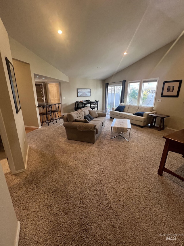 carpeted living area with recessed lighting, baseboards, and lofted ceiling